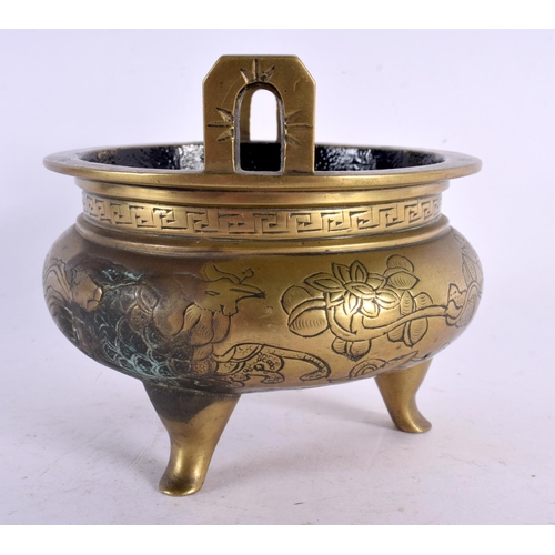 2384 - A 19TH CENTURY CHINESE TWIN HANDLED BRONZE CENSER bearing Xuande marks to base. 11 cm wide, internal... 