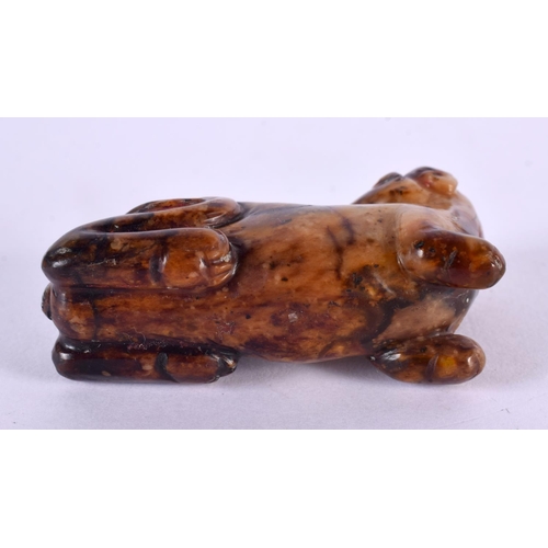 2427 - A CHINESE QING DYNASTY CARVED RUSSET JADE FIGURE OF A BEAST. 6.5 cm x 3 cm.