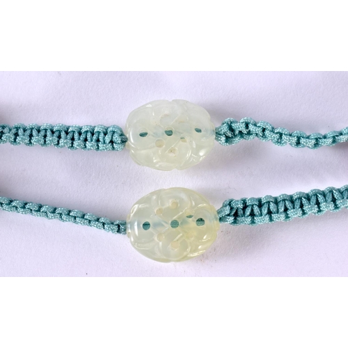 2430 - AN EARLY 20TH CENTURY CHINESE CARVED JADE AND AGATE NECKLACE Late Qing/Republic. 66 cm long, pendant... 