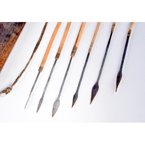 3226 - An early African tribal wooden arrow quiver. 73cm.