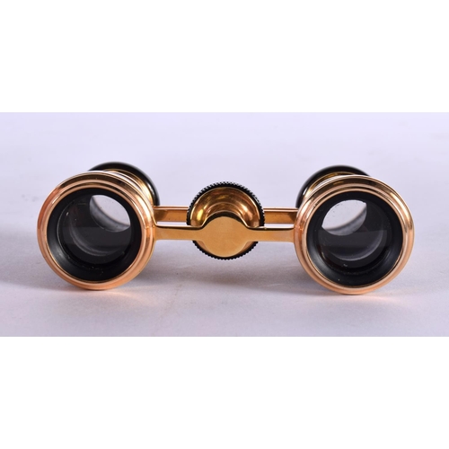 487 - A CASED  PAIR OF ANTIQUE GILT AND DARK ABALONE SHELL OPERA GLASSES.  6.5cm (closed) 4.7cm (extended)... 
