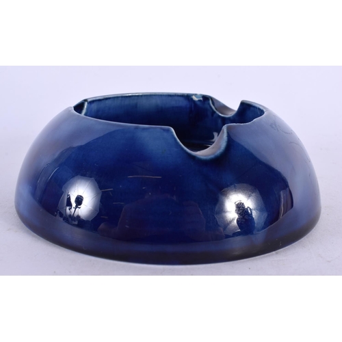 90 - A MOORCROFT POTTERY ASHTRAY. 13 cm wide.