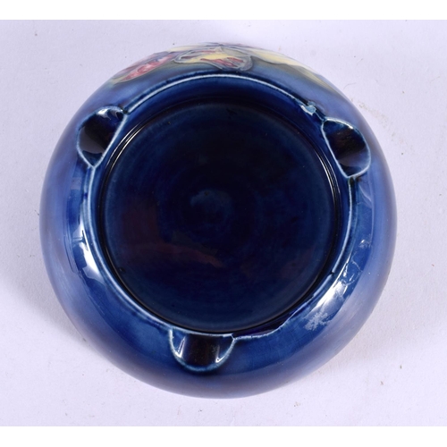 90 - A MOORCROFT POTTERY ASHTRAY. 13 cm wide.
