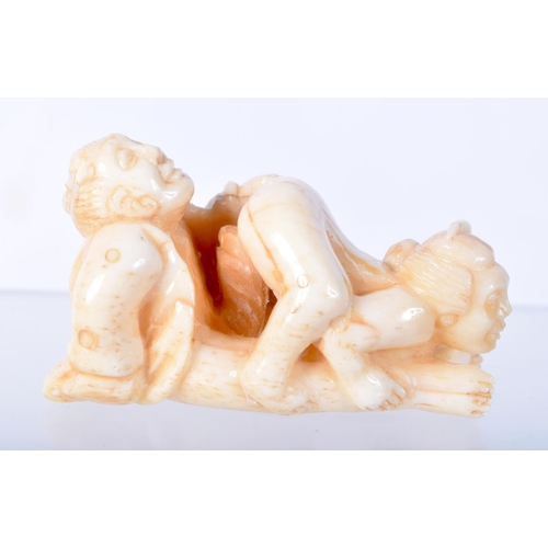 1381 - A CARVED BONE EROTIC NETSUKE.  5.5cm x 3.1cm x 2.9cm