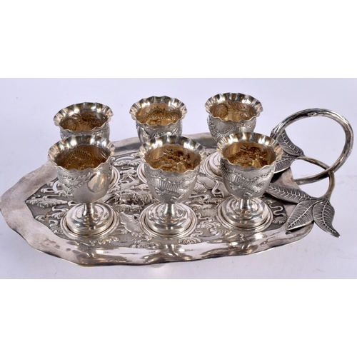 118 - AN UNUSUAL SET OF LATE 19TH CENTURY CHINESE EXPORT SILVER CUPS ON STAND by Luen Wo, decorated with d... 