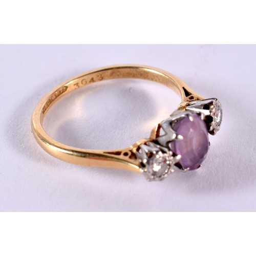 129 - 18ct Gold Amethyst And Diamond Set Trilogy Ring. Q. 3.6 grams.