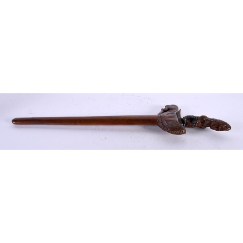 13 - AN UNUSUAL 18TH CENTURY DUTCH CARVED FRUITWOOD CASED KRISS DAGGER with seaweed affect blade, the han... 