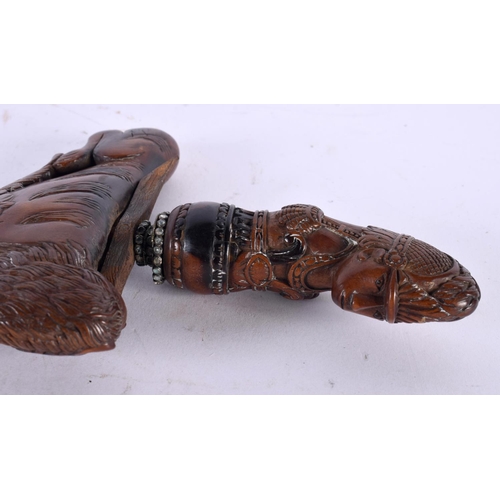 13 - AN UNUSUAL 18TH CENTURY DUTCH CARVED FRUITWOOD CASED KRISS DAGGER with seaweed affect blade, the han... 