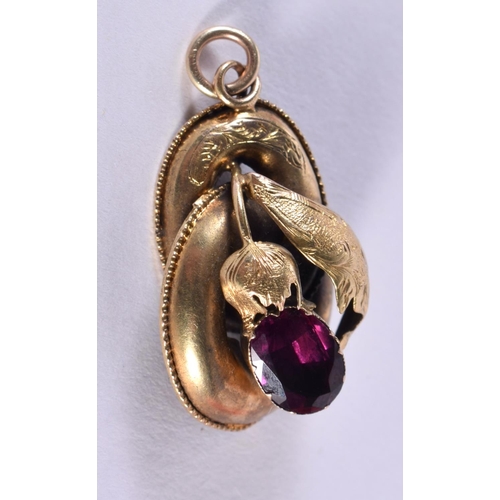 146 - 18ct Gold Victorian Garnet Set Knot Pendant. 2.3 grams. 3 cm x 1.75 cm.