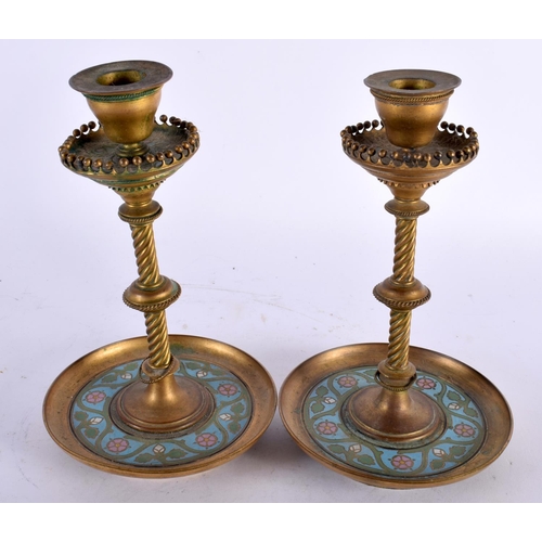 15 - A PAIR OF 19TH CENTURY FRENCH BRONZE AND CHAMPLEVE ENAMEL CANDLESTICKS with spiral formed central st... 