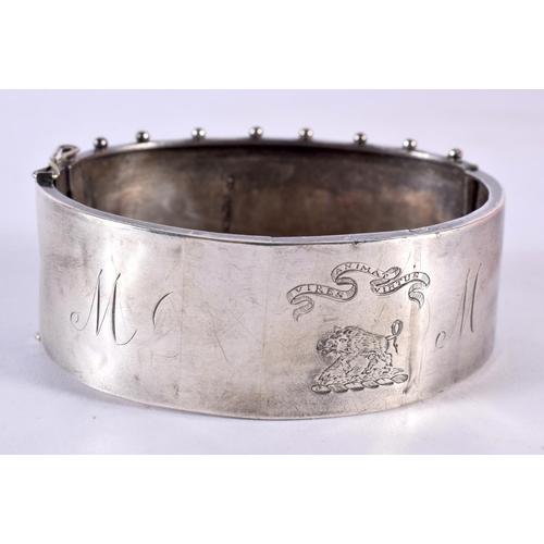 178 - A Victorian Silver Aesthetic Movement Bangle With Gold Detailing. Birmingham 1882. 36 grams. 6.75 cm... 