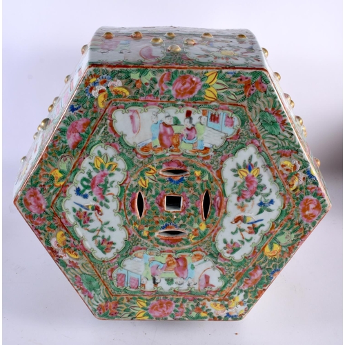 25 - A 19th Century Chinese Canton famille rose hexagonal garden seat, finely detailed with panels of but... 