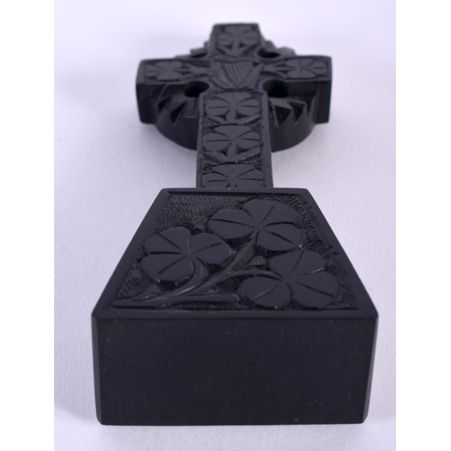 33 - AN IRISH BOG OAK KILLARNEY CROSS decorated all over with shamrock. 59.2 grams. 12 cm x 6 cm. Note: B... 