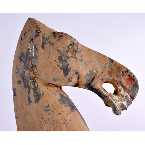 38 - A Chinese Grey Pottery Horse with much of the original painted decoration under earth encrustation. ... 