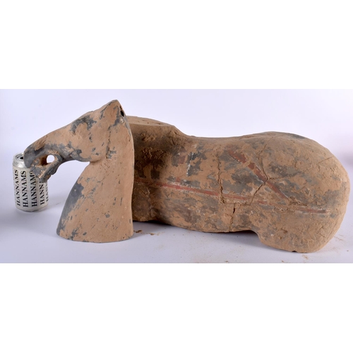 38 - A Chinese Grey Pottery Horse with much of the original painted decoration under earth encrustation. ... 