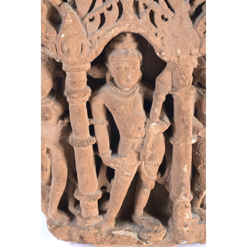 6 - A 10th / 11th Century Buff Sandstone Relief depicting Shiva in Tribhanga in an alcove flanked by pil... 