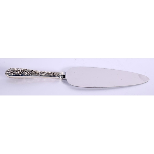 99 - A SILVER HANDLED CAKE SLICE by Kirk. 108 grams overall. 25 cm x 5.25 cm.