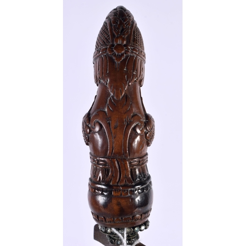 13 - AN UNUSUAL 18TH CENTURY DUTCH CARVED FRUITWOOD CASED KRISS DAGGER with seaweed affect blade, the han... 