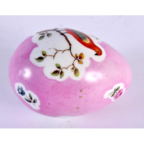 1 - A 19TH CENTURY CONTINENTAL PORCELAIN PINK GROUND EGG painted with birds perched amongst landscapes. ... 