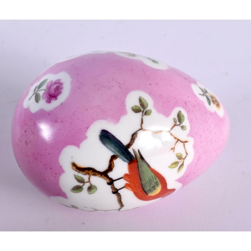 1 - A 19TH CENTURY CONTINENTAL PORCELAIN PINK GROUND EGG painted with birds perched amongst landscapes. ... 