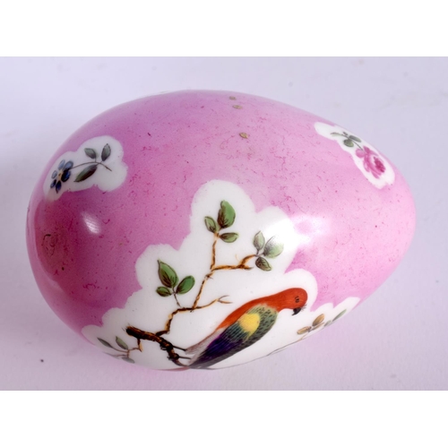 1 - A 19TH CENTURY CONTINENTAL PORCELAIN PINK GROUND EGG painted with birds perched amongst landscapes. ... 