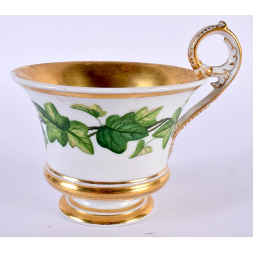 113 - A GERMAN KPM BERLIN PORCELAIN CABINET CUP AND SAUCER painted with green flowers. 14cm wide.