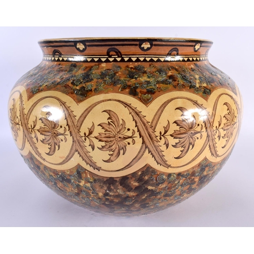 116 - A LARGE ARTS AND CRAFTS MINTON POTTERY JARDINIERE painted in mocha tones with foliage and vines. 30c... 