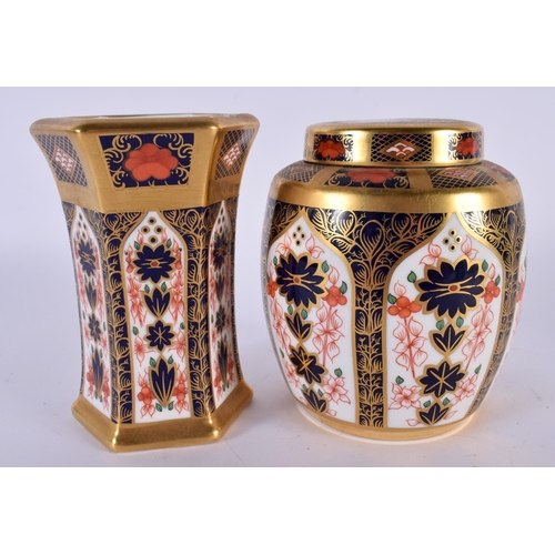 123 - A ROYAL CROWN DERBY IMARI 1128 TEA CADDY AND COVER together with a similar vase. 11cm high. (2)