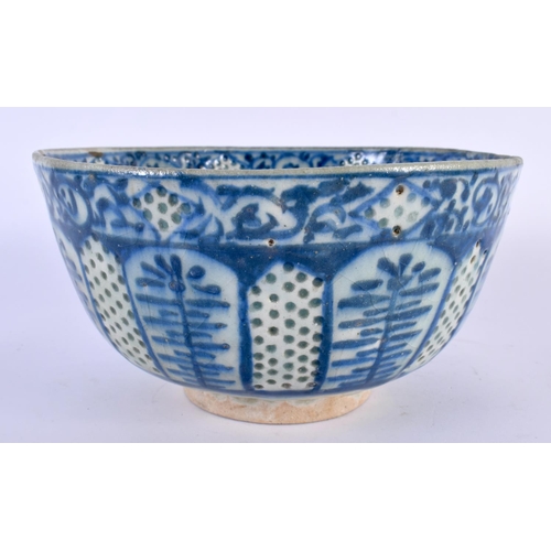 126 - A 14TH/15TH CENTURY ISLAMIC MIDDLE EASTERN POTTERY BOWL painted with motifs under an overglazed reti... 