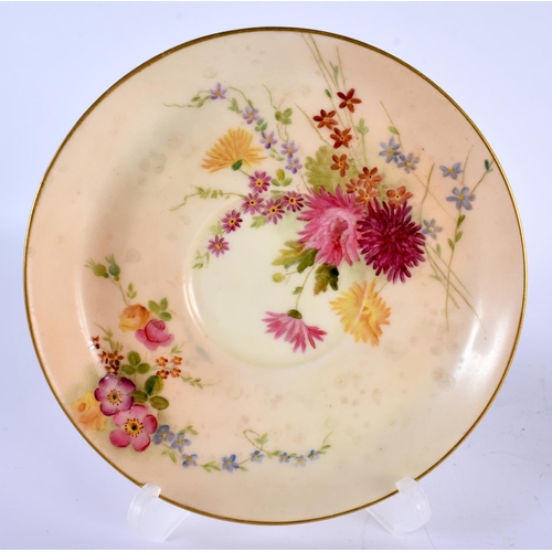 127 - A ROYAL WORCESTER BLUSH IVORY MOUSTACHE CUP AND SAUCER painted with flowers. 14cm diameter. (2)