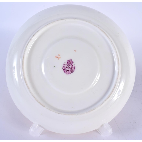 127 - A ROYAL WORCESTER BLUSH IVORY MOUSTACHE CUP AND SAUCER painted with flowers. 14cm diameter. (2)