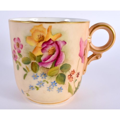 127 - A ROYAL WORCESTER BLUSH IVORY MOUSTACHE CUP AND SAUCER painted with flowers. 14cm diameter. (2)