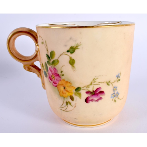 127 - A ROYAL WORCESTER BLUSH IVORY MOUSTACHE CUP AND SAUCER painted with flowers. 14cm diameter. (2)