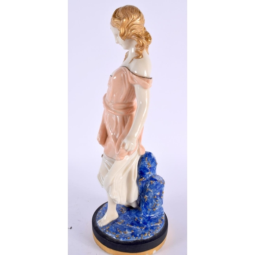 132 - AN UNUSUAL 19TH CENTURY ENGLISH PORCELAIN FIGURE OF A FEMALE probably Worcester. 28cm high.