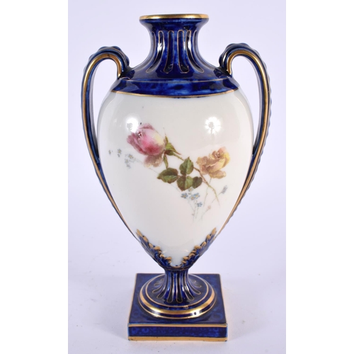 145 - A ROYAL WORCESTER TWIN HANDLED PORCELAIN VASE painted with flowers. 18cm high.