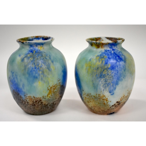 151 - 20th century Ruskin pair of pottery vases of ovaled form with streaked blue and brown glaze.  24cm h... 