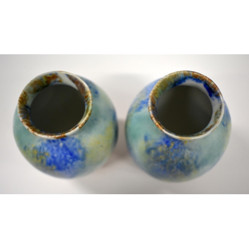 151 - 20th century Ruskin pair of pottery vases of ovaled form with streaked blue and brown glaze.  24cm h... 