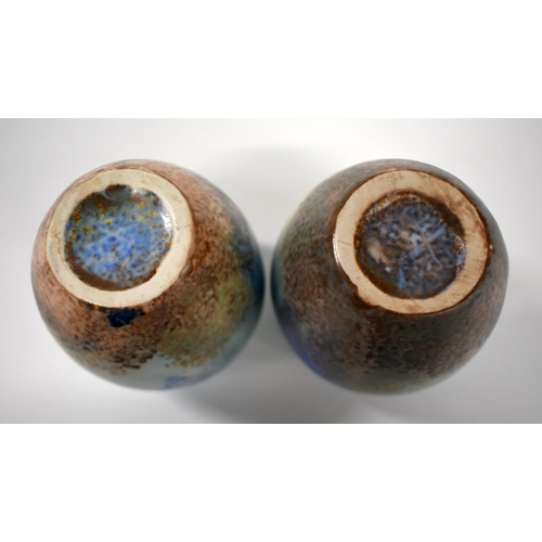 151 - 20th century Ruskin pair of pottery vases of ovaled form with streaked blue and brown glaze.  24cm h... 