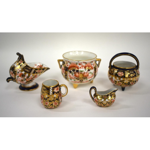 152 - 20th century Royal Crown Derby miniature wares consisting of a mug, sauceboat, spoon warmer, cauldro... 