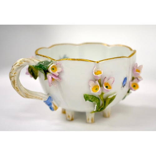 160 - Late 19th century Meissen floral encrusted cup and saucer painted with flowers and insects, crossed ... 