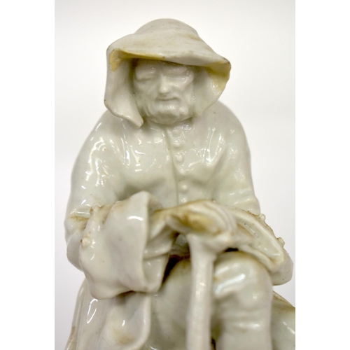 165 - 18th century Bow white glazed figure winter of seated on a pile of logs.  12.5cm high