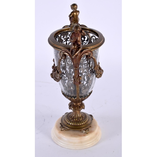 17 - A MID 19TH CENTURY FRENCH BRONZE AND GLASS VASE with unusual silver work interior. 23 cm high.