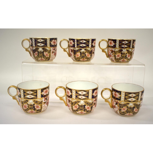 216 - Royal Crown Derby set of six coffee cans and saucers, painted with imari pattern 2451, having ornate... 