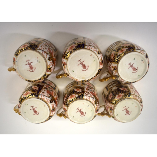 216 - Royal Crown Derby set of six coffee cans and saucers, painted with imari pattern 2451, having ornate... 