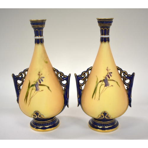 223 - Royal Worcester rare pair of miniature vases painted in enamels with flowers on an blush ivory groun... 