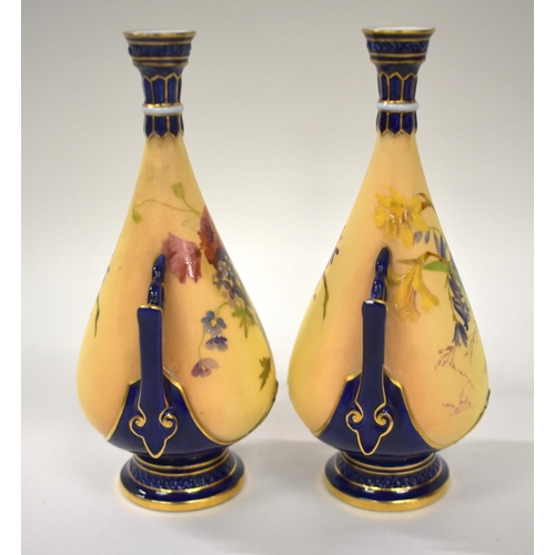 223 - Royal Worcester rare pair of miniature vases painted in enamels with flowers on an blush ivory groun... 