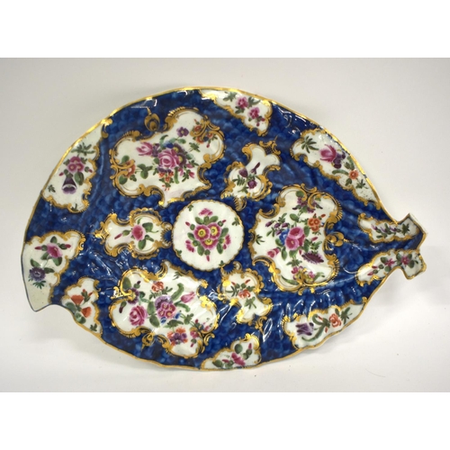 237 - 18th century Worcester cos lettuce leaf shaped dish painted with flowers on a blue scale ground.  25... 