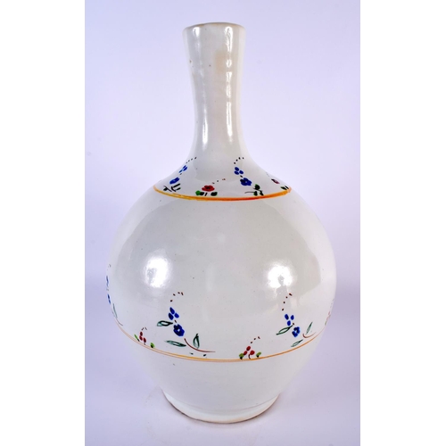 24 - A LARGE CONTINENTAL TIN GLAZED FAIENCE BULBOUS POTTERY VASE painted with sparse floral sprays. 30cm ... 