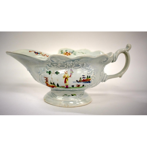 241 - 18th century Worcester early sauceboat of moulded high footed form painted with oriental figures on ... 