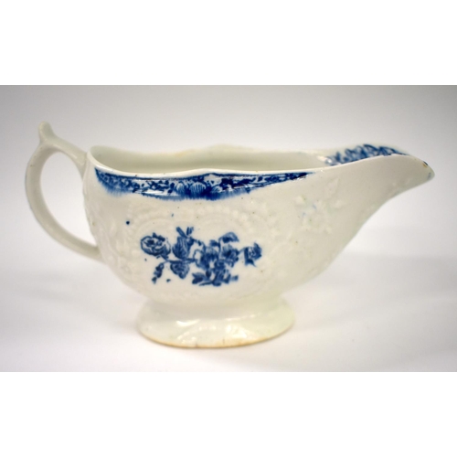 250 - 18th century Lowestoft floral moulded sauceboat painted and printed with in underglaze blue with flo... 